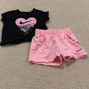 Nike short sleeve short and shorts. Size 6 months.